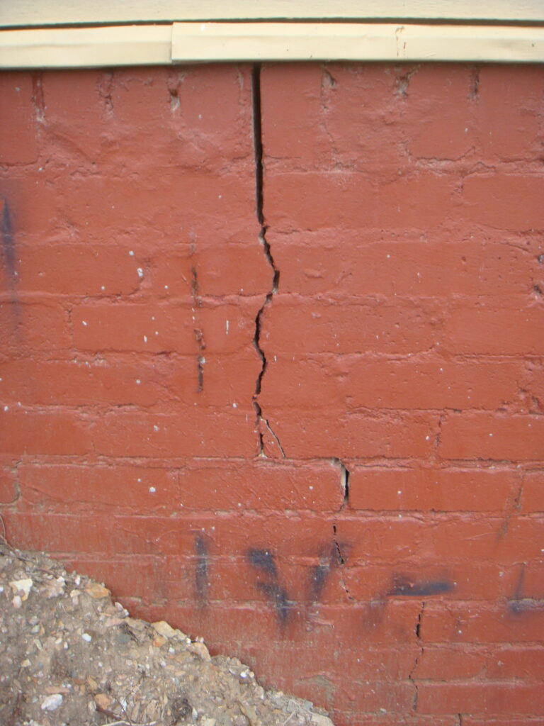 vertical crack in brick wall