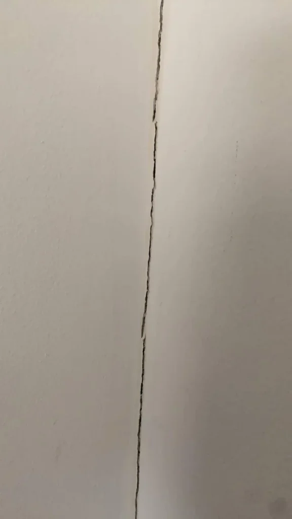 vertical crack in the corners